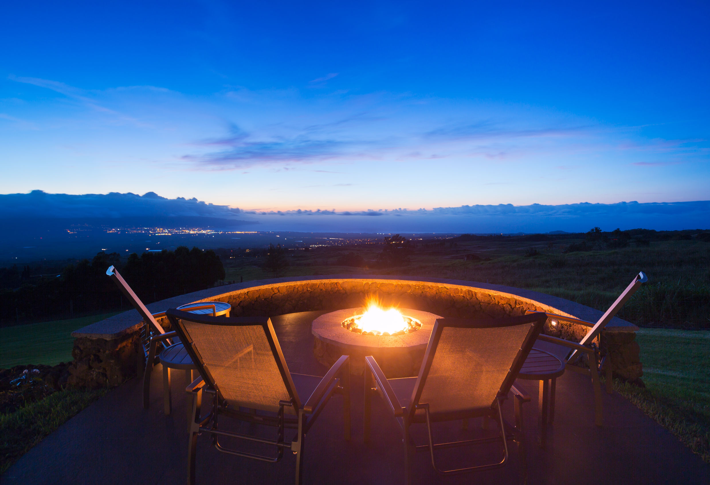 Firepit Outdoor in-ground pool with covered seating area