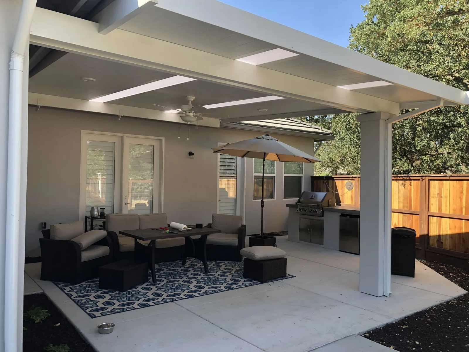 Aluminum lattice patio cover over an outdoor kitchen