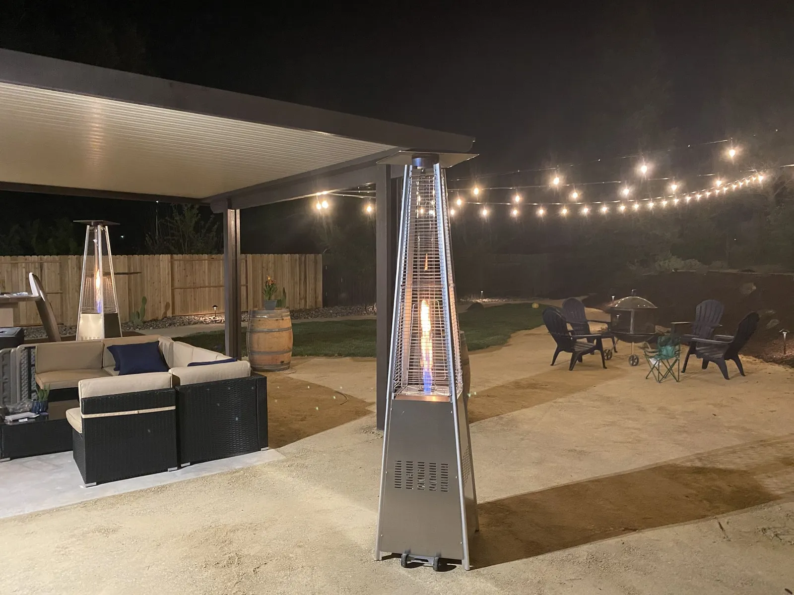 Covered patio at night with string lights