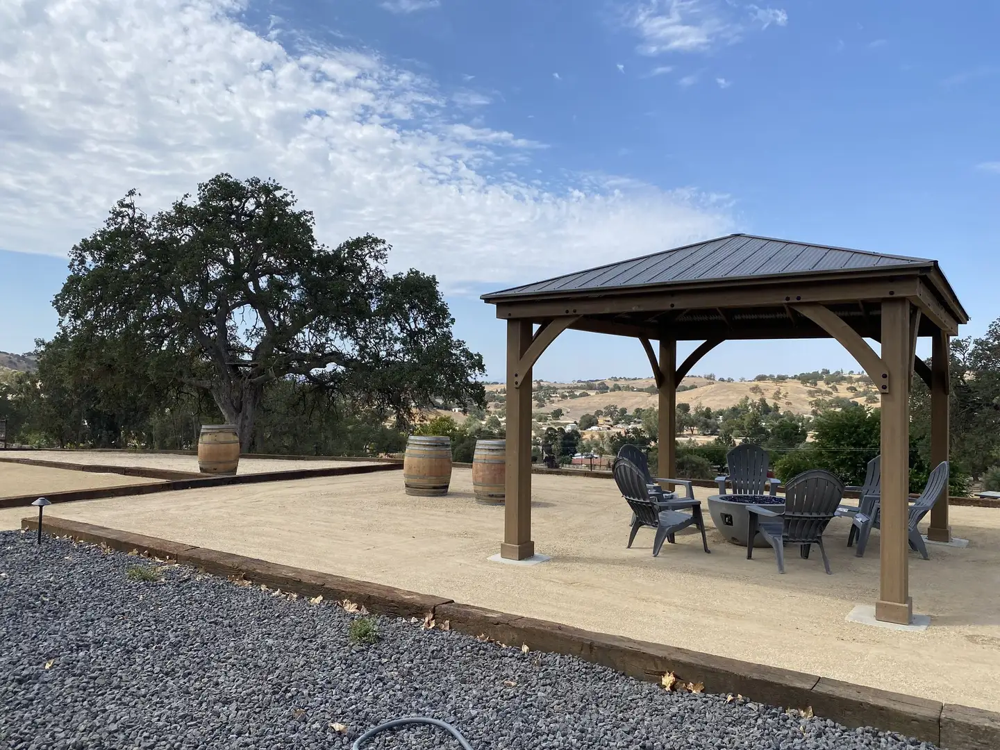 Metal roof gazebo with a patio set on decomposed granite
