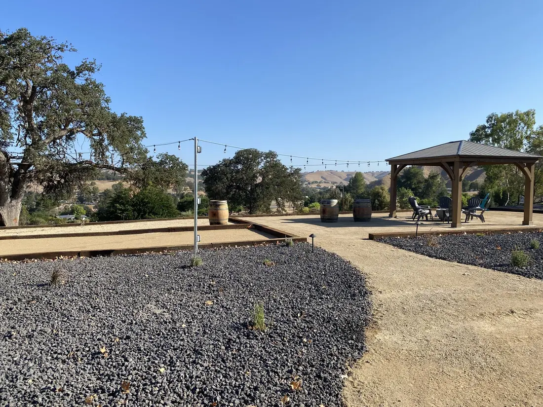 Decomposed granite path leading to a gravel gazebo pad