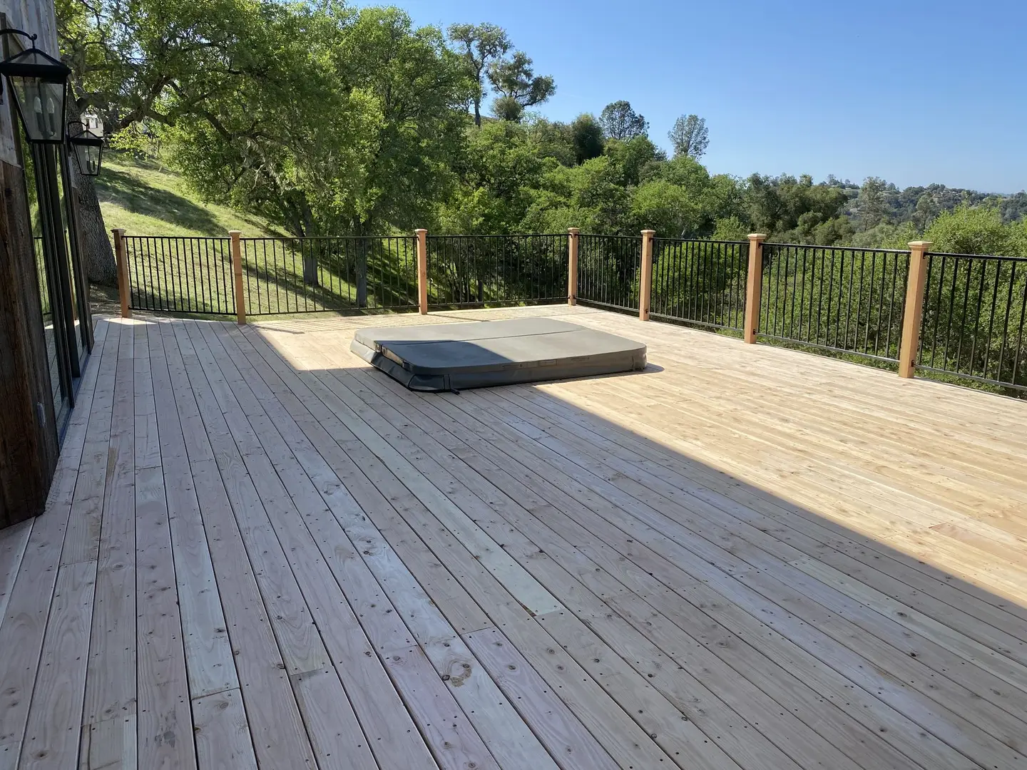 Wood deck with cedar posts and cable-style railing